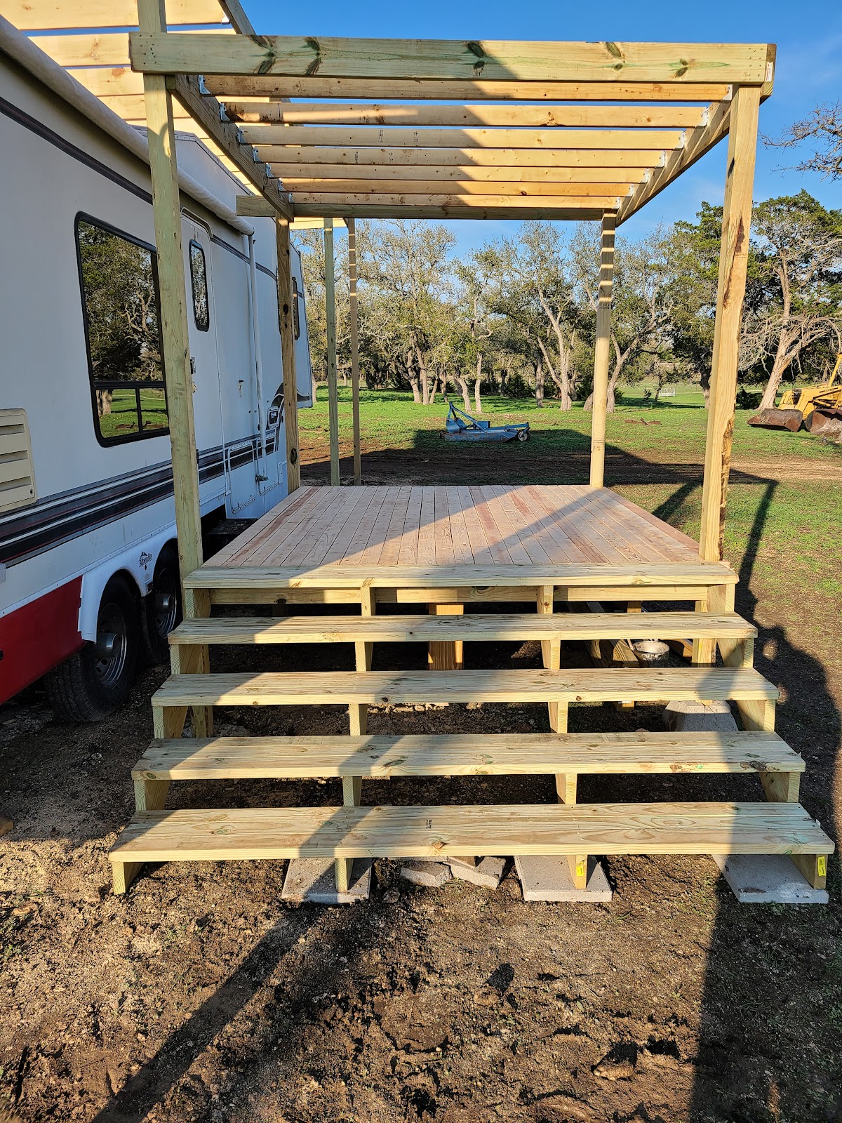 New deck and pergola built from fresh lumber