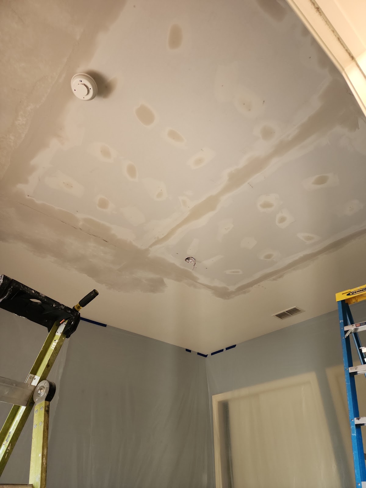 Interior drywall and ceiling patching in progress